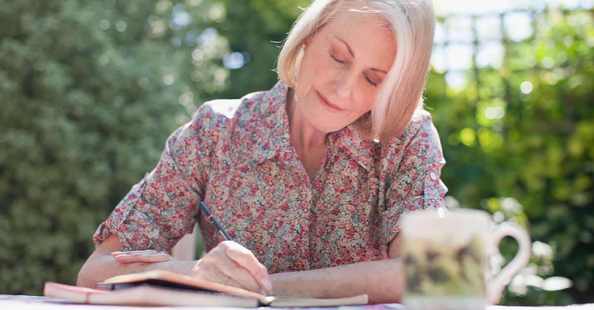 Senior woman writing in her journal