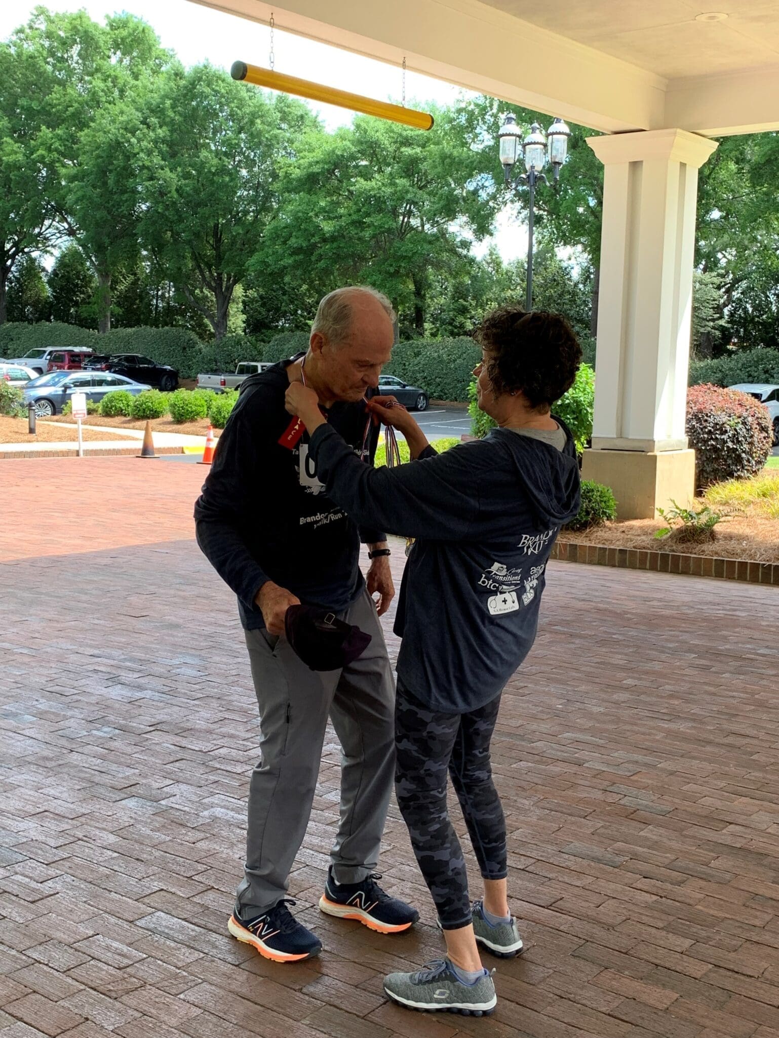 Senior Man Interacting with Woman After Completing Race