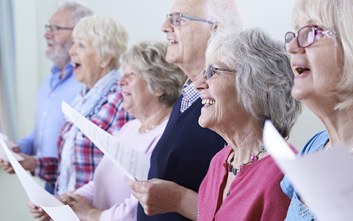 Group Of Seniors Singing In Choir Together