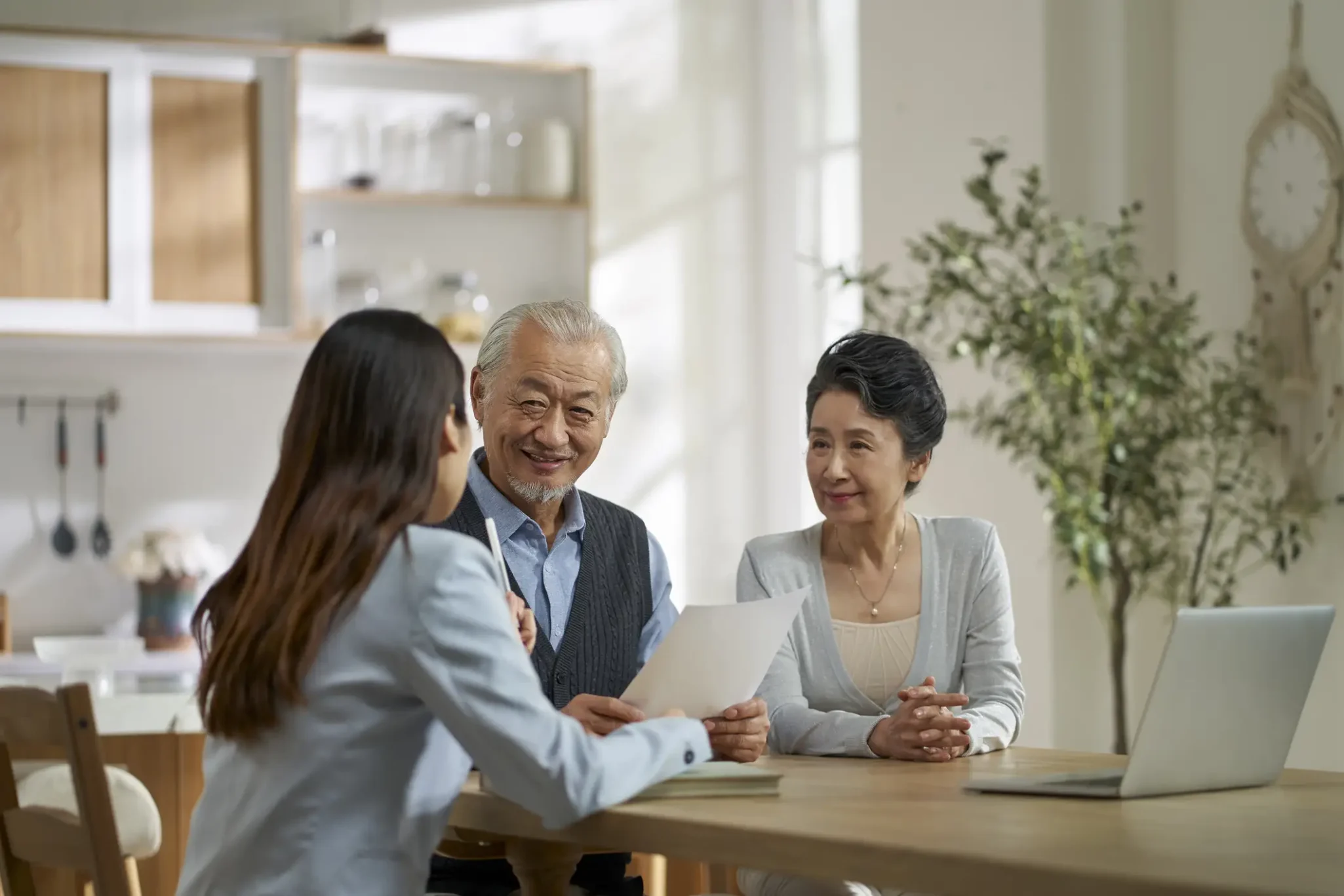Senior couple speaking with a financial advisor