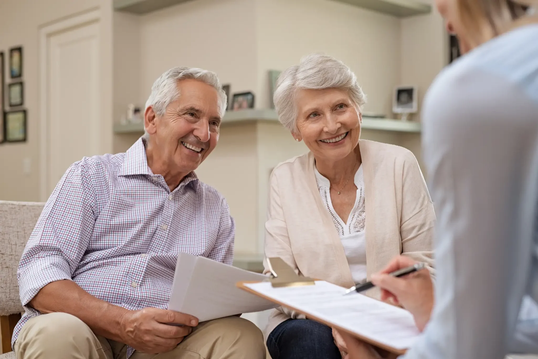 Senior couple discussing their finances with a consultant