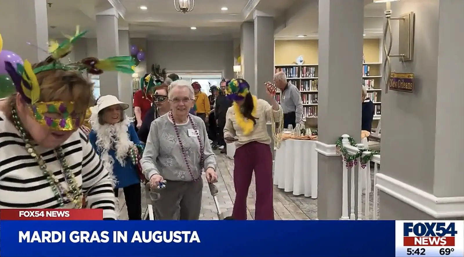 BWILDE-Mardi-Gras Brandon Wilde residents celebrating Mardi Gras with festive masks and beads in Augusta, GA.