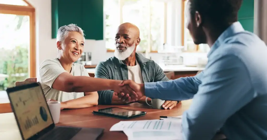 A couple meeting with a financial advisor to discuss retirement planning tips for seniors in Evans, GA, at Brandon Wilde.