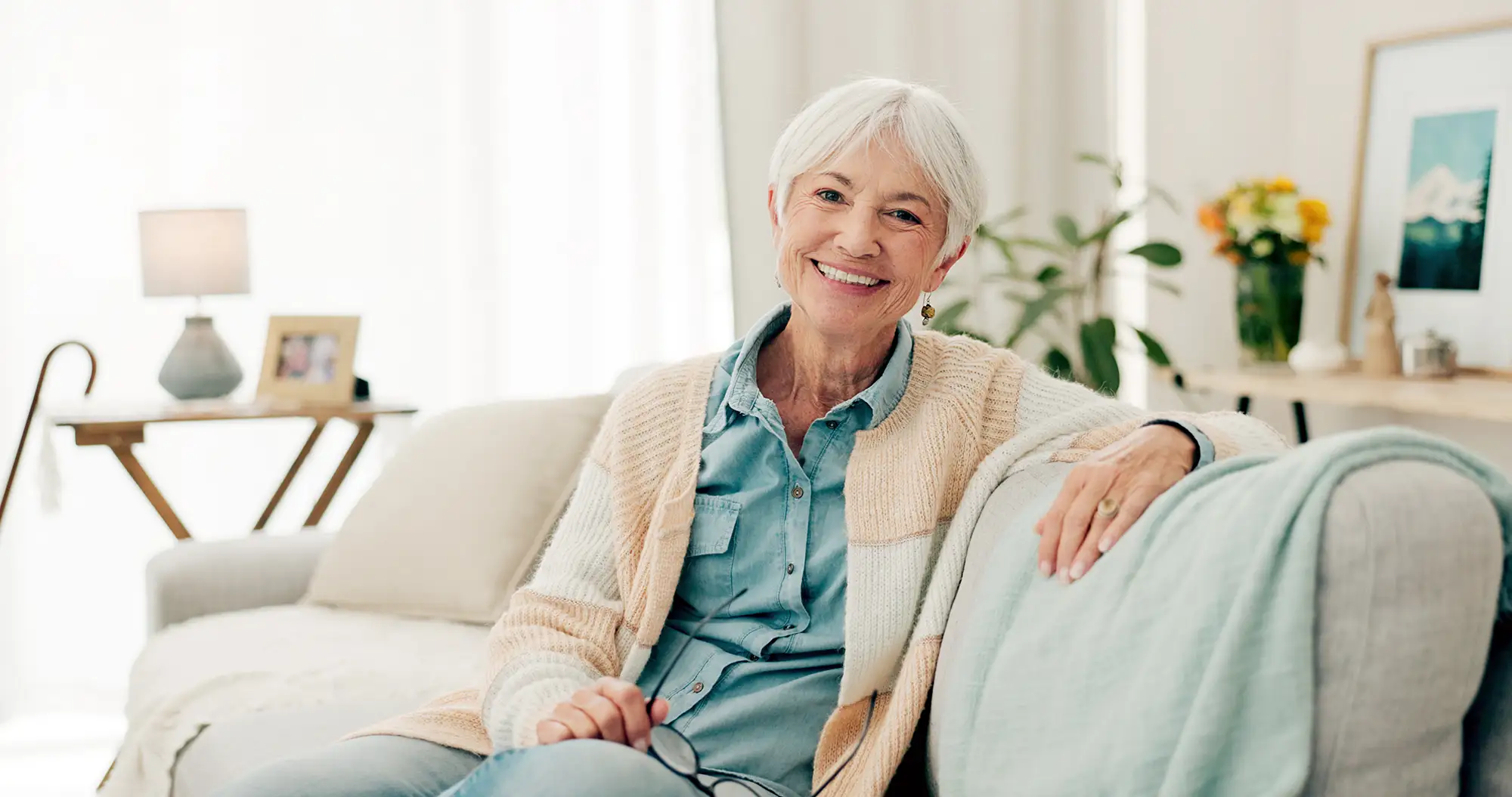 Senior Woman Relaxing On a Sofa