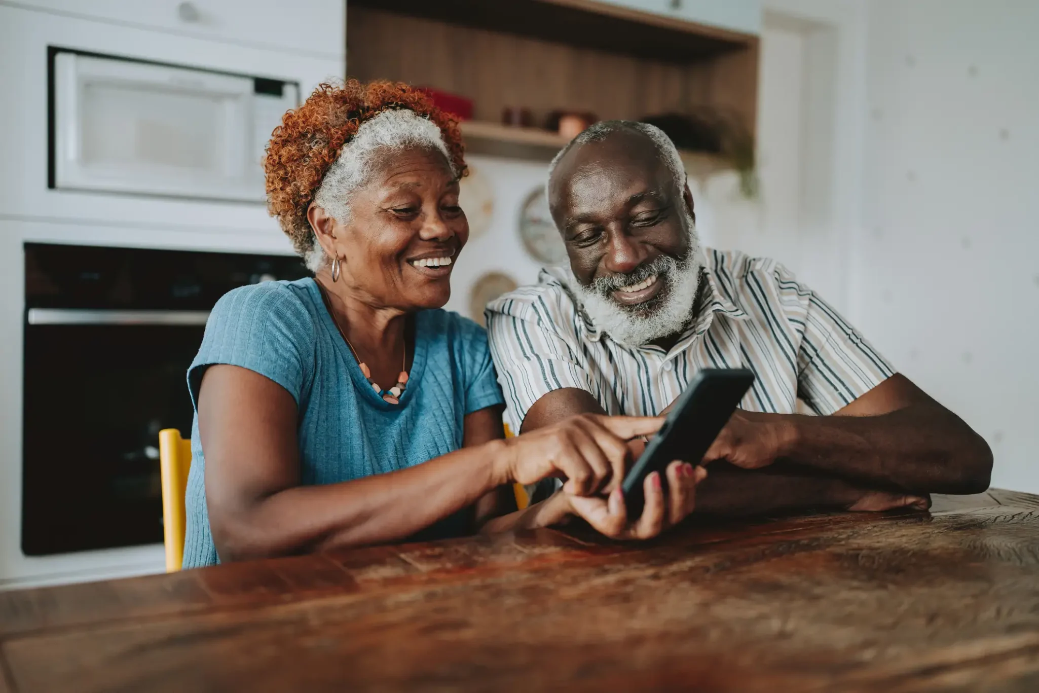 Senior couple using an app on a smartphone
