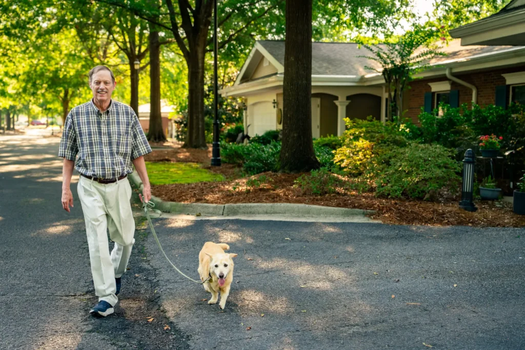 Brandon Wilde elderly resident walking his dog in Augusta, GA.