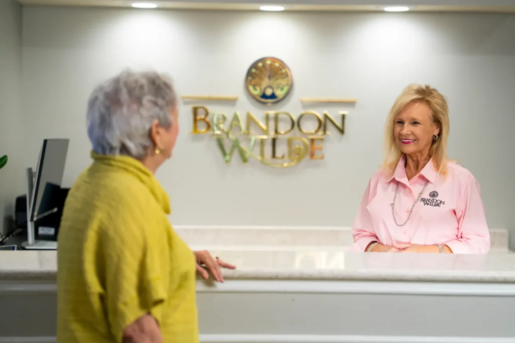 Resident receives assistance from Brandon Wilde concierge.