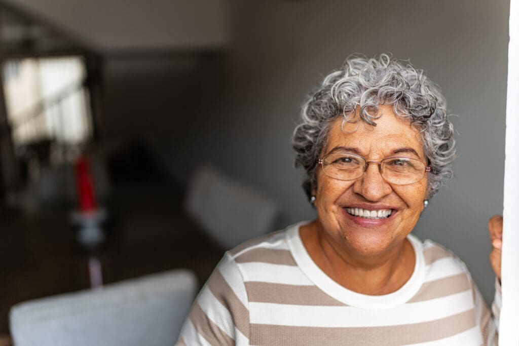 Senior woman smiling in home