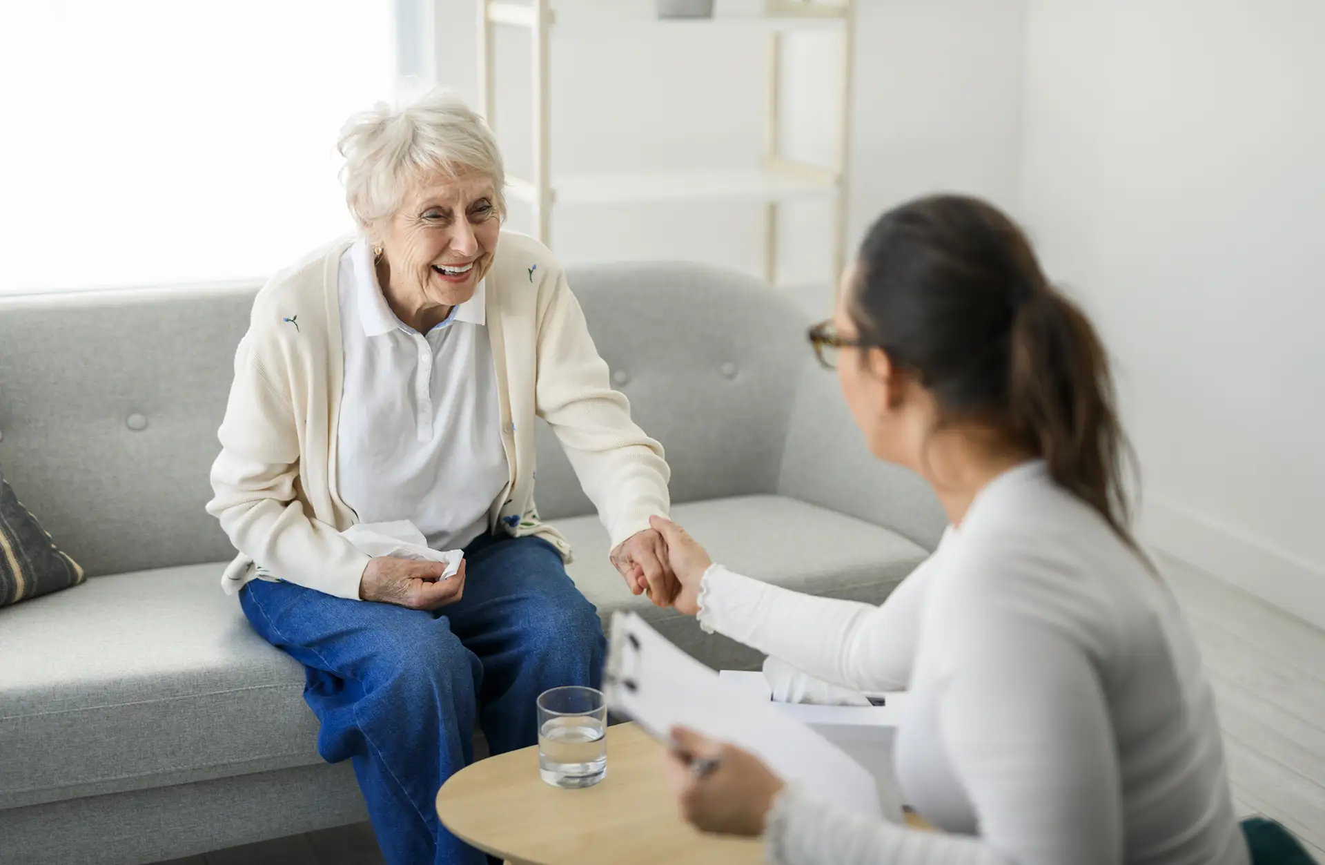Senior woman smiling with her caregiver